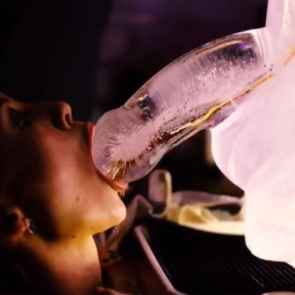 Huge Penis Ice Luge - Party Novelty being enjoyed at a lively party setting.