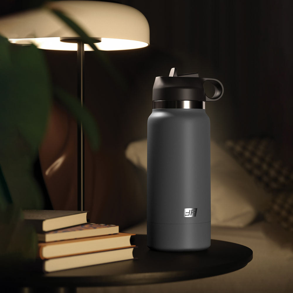 PDX Plus Fuck Flask - Secret Delight -  Discreet Vagina Stroker next to a lamp on a nightstand with books.