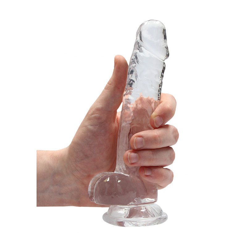 REALROCK 7'' Realistic Dildo With Balls -  17.8 cm Dong held in hand showcasing its crystal clear design.