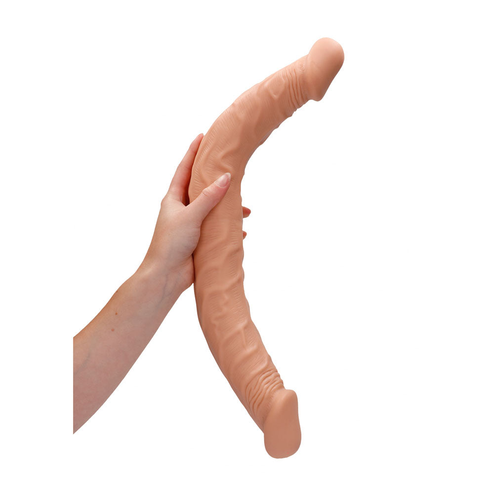 REALROCK 18'' Double Dildo -  46 cm Double Dong held in hand, showcasing its lifelike design and soft texture.