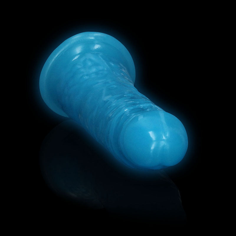 REALROCK 15.5 cm Slim Glow in the Dark Neon -  - Glow in Dark  15.5 cm (6'') Dong illuminated against a dark background.