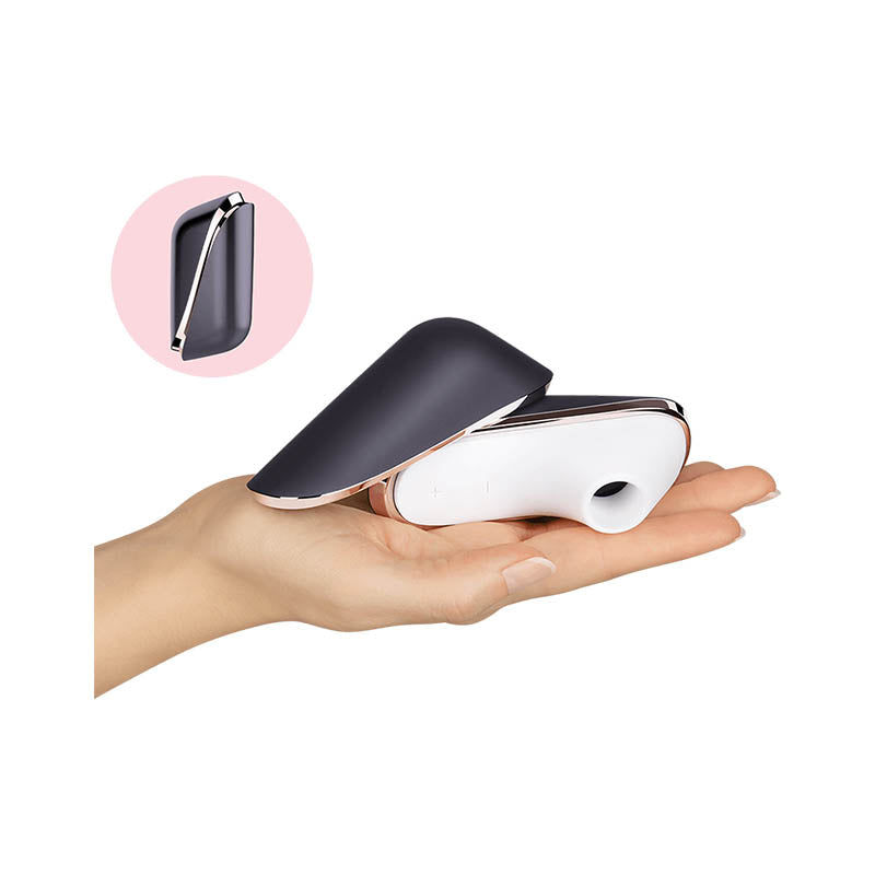 Satisfyer Pro Traveller - USB Rechargeable Touch-Free Clitoral Stimulator held in hand with compact design.