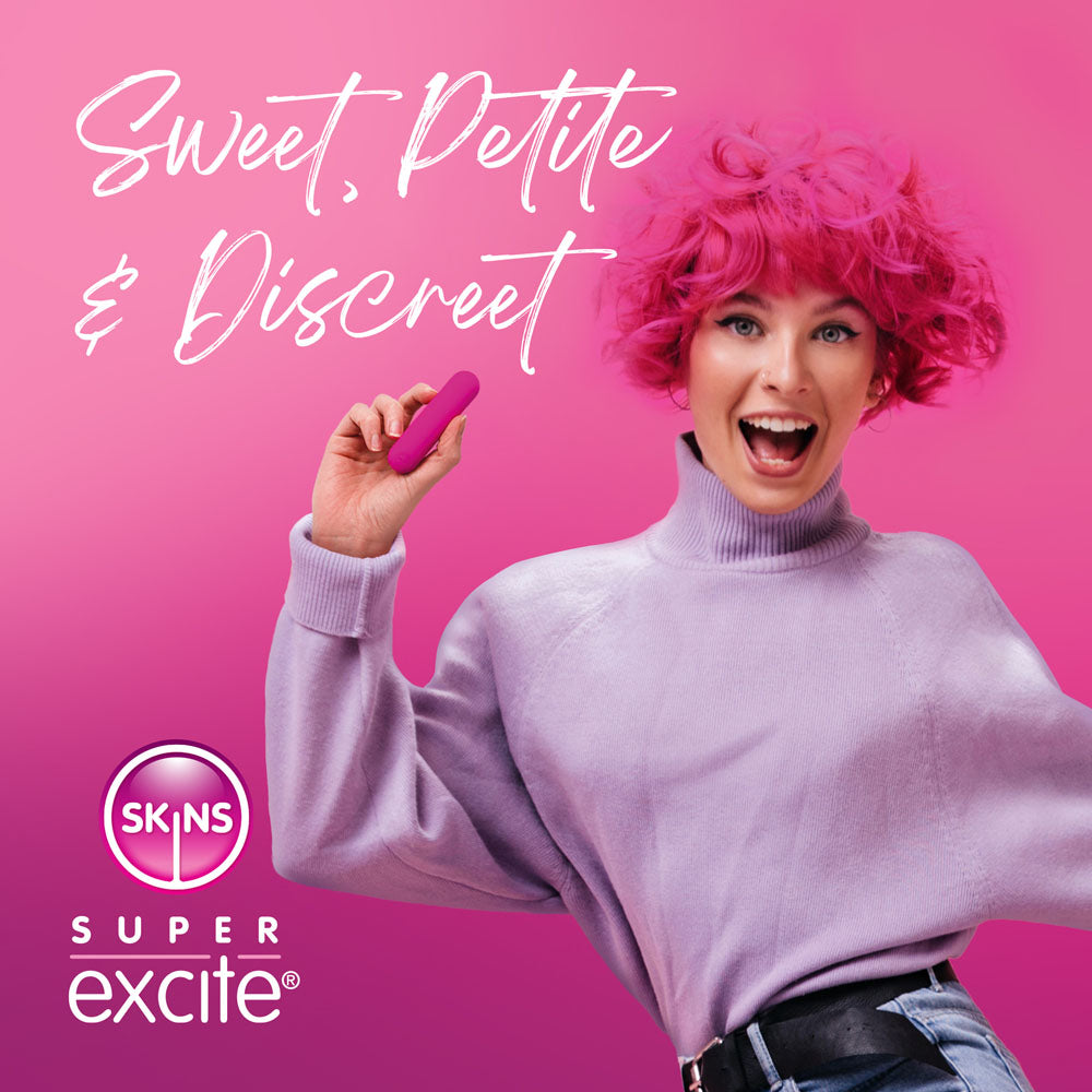 Skins Super Excite Rechargeable Bullet - USB Rechargeable Bullet shown with a joyful woman in a pink top, highlighting discreet pleasure.