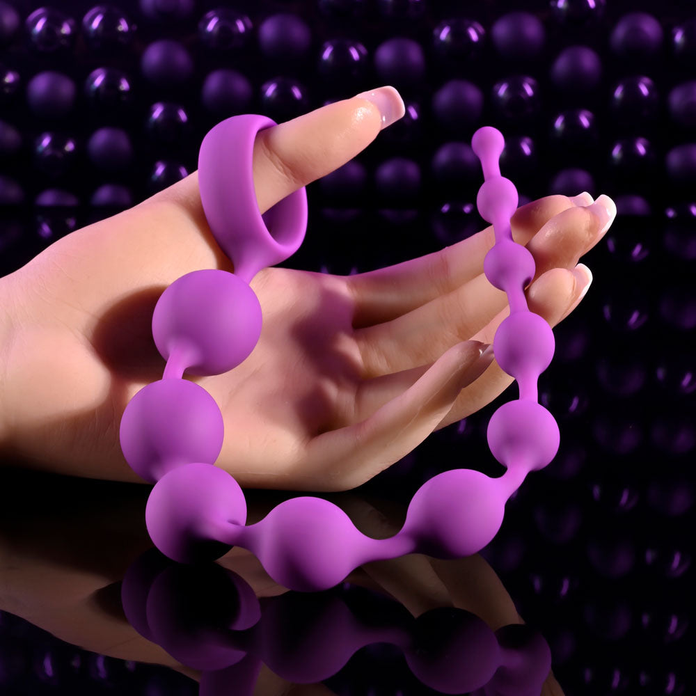 Selopa BEADED ADVENTURE -  35.5 cm Anal Beads held in hand, showcasing elegant design and silicone beads.