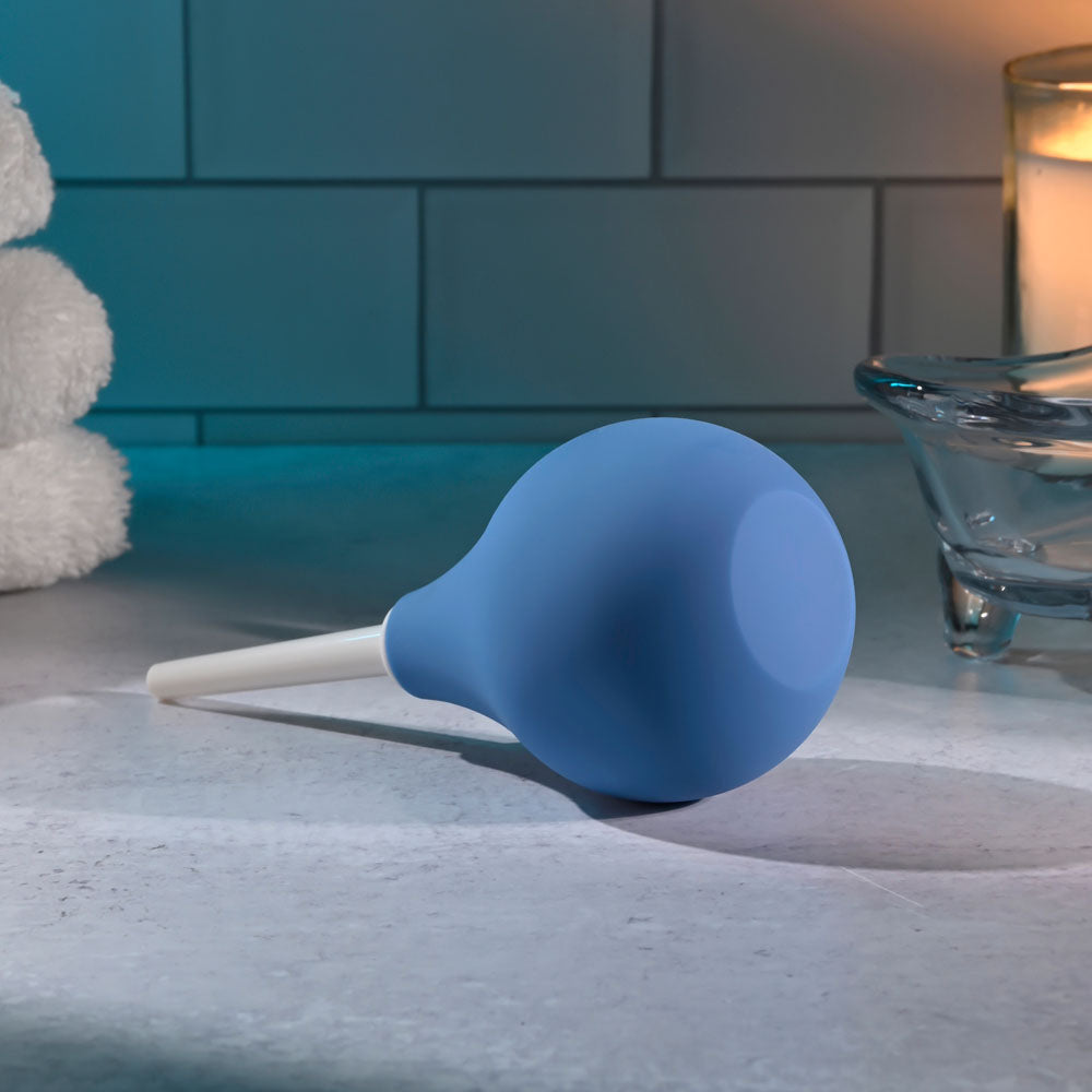 Selopa SQUEAKY CLEAN -  Unisex Douche resting on a bathroom counter, perfect for gentle anal cleansing.