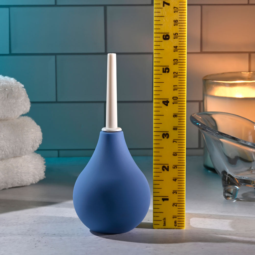 Selopa SQUEAKY CLEAN -  Unisex Douche with a blue silicone exterior and measuring tape for size reference.