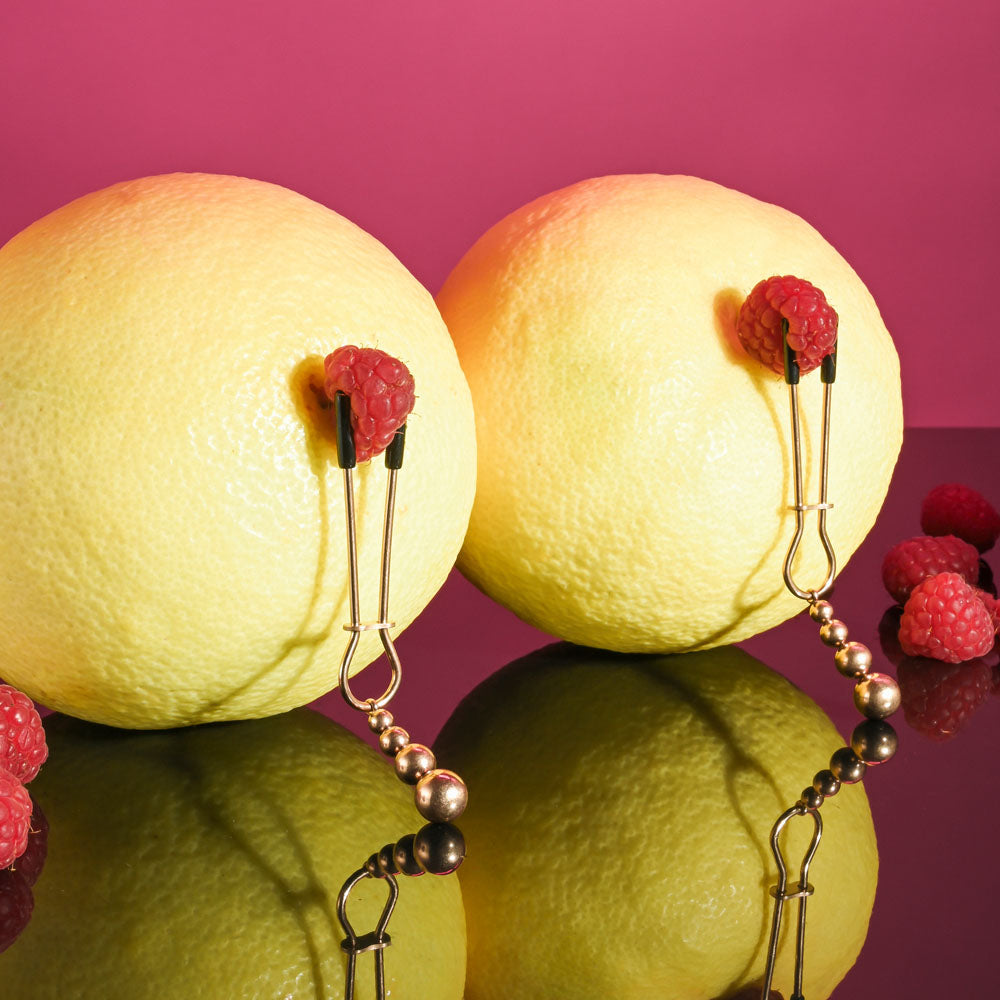 Selopa BEADED NIPPLE CLAMPS -  -  Nipple Clamps - Set of 2 on yellow lemons with raspberries.