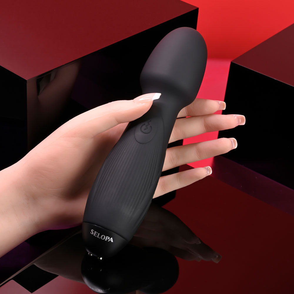 Selopa POWER TRIP - 18.8 cm USB Rechargeable Massage Wand held in hand against a striking background.