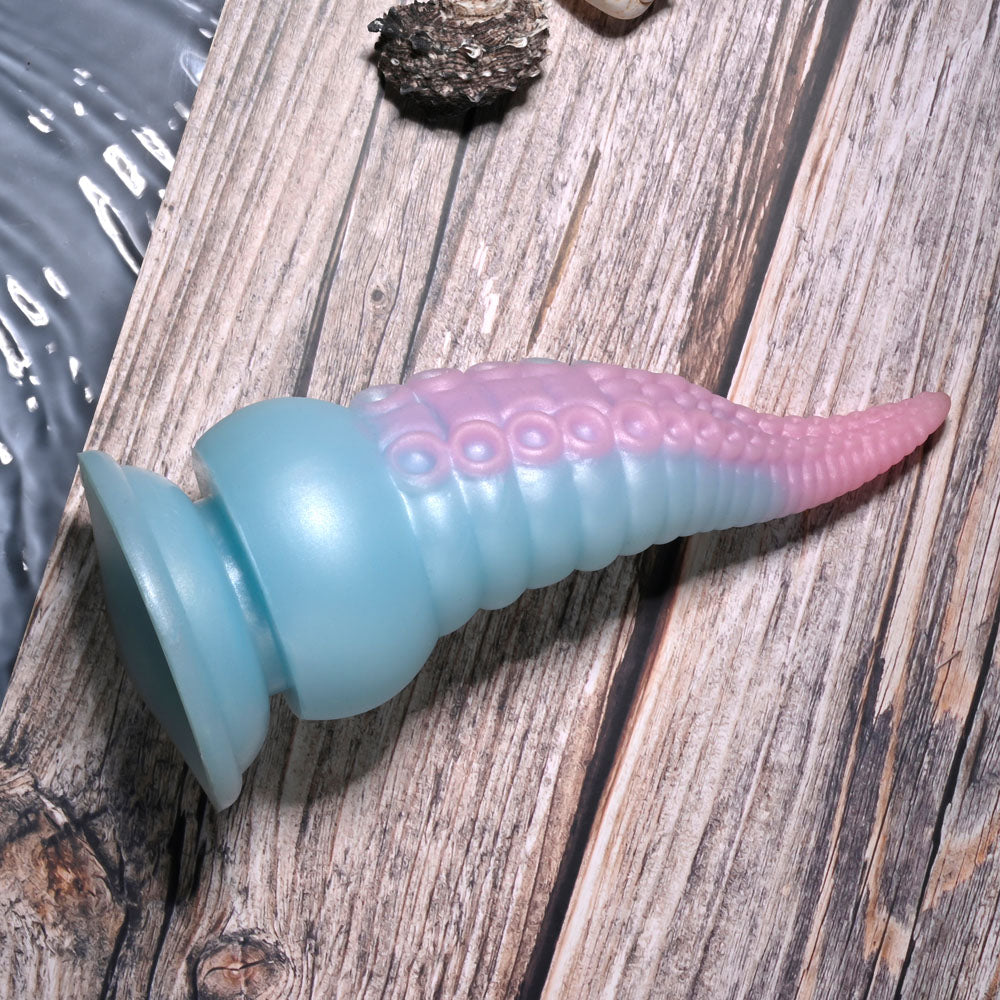 Selopa STUCK ON YOU - Blue/Pink 19 cm USB Rechargeable Vibrating Tentacle Fantasy Dildo on rustic wood background.