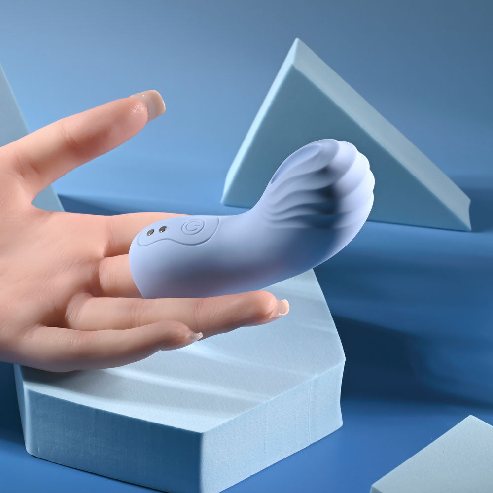 Selopa GOOD POINT -  USB Rechargeable Hollow Vibrating Finger Stimulator in a hand, showcasing its unique ergonomic design.