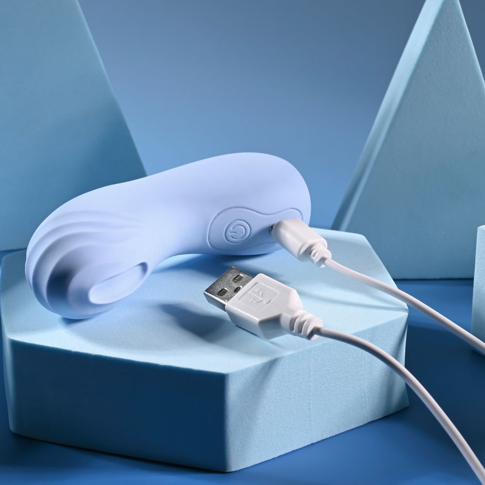 Selopa GOOD POINT -  USB Rechargeable Hollow Vibrating Finger Stimulator with USB cable on a blue geometric surface.