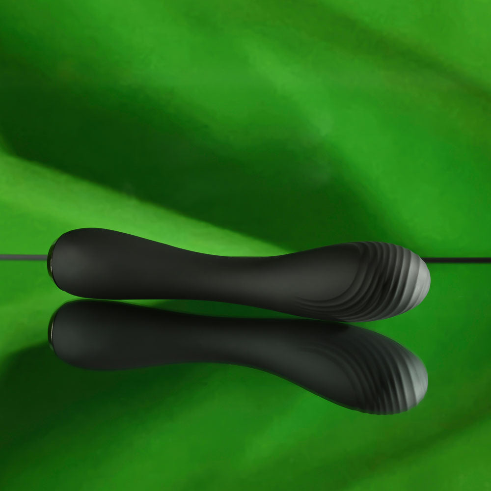 Selopa MIDNIGHT MAGIC -  20.2 cm USB Rechargeable Vibrator on a reflective surface with a green background.
