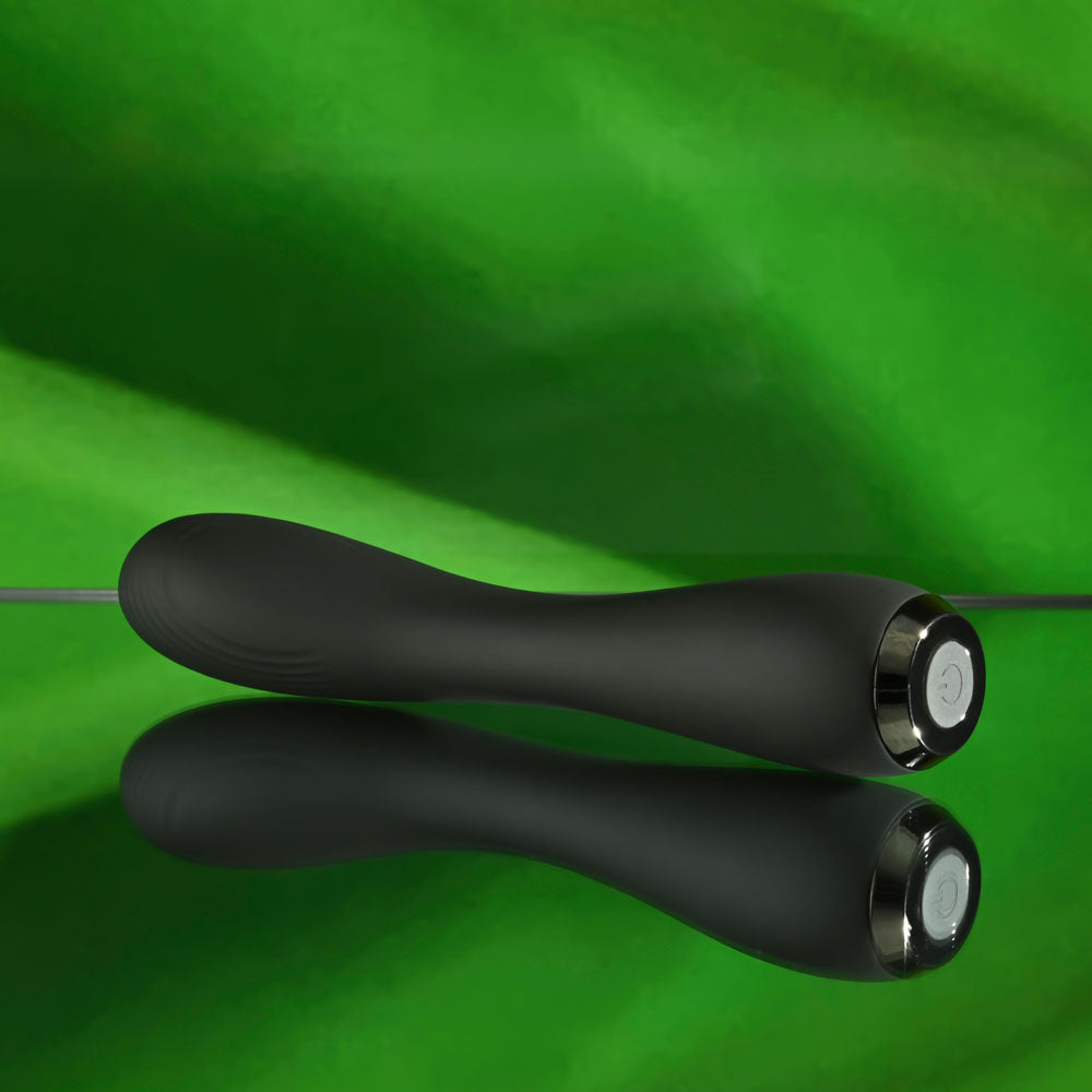 Selopa MIDNIGHT MAGIC - 20.2 cm USB Rechargeable Vibrator on a reflective surface with green background.