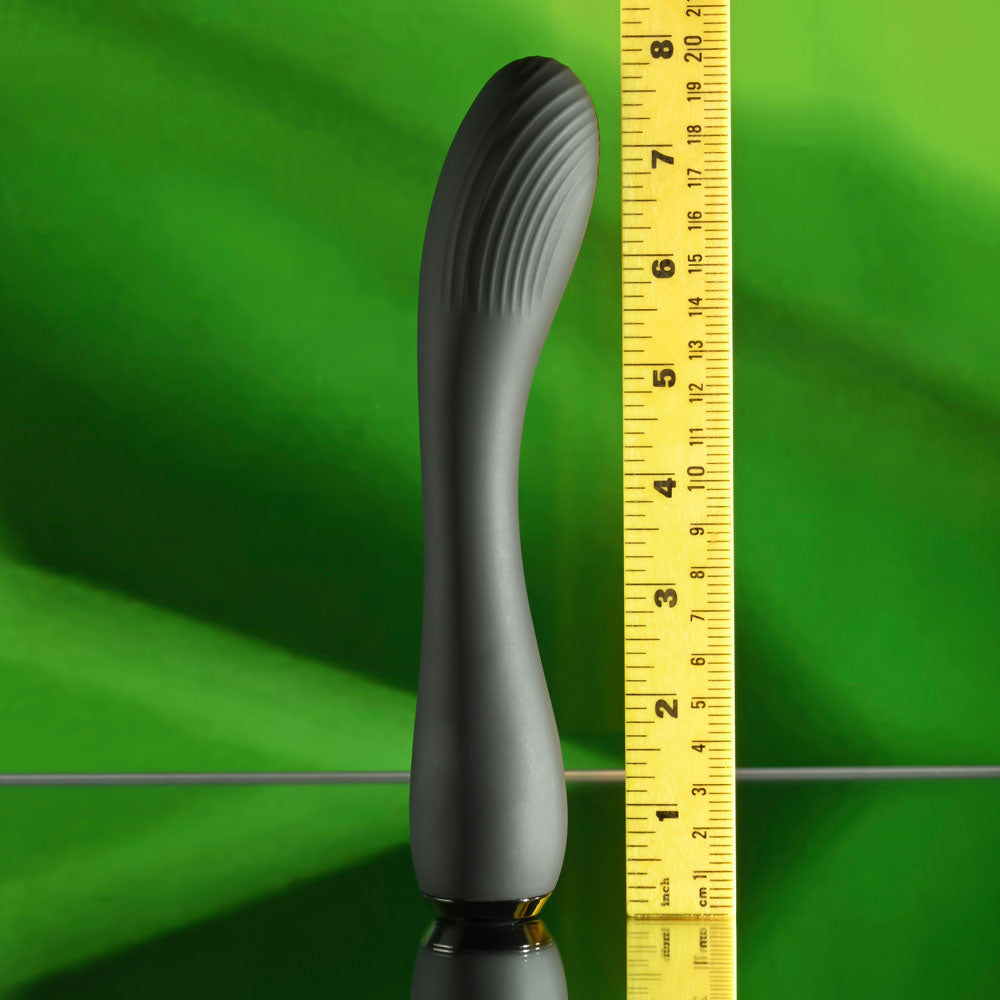 Selopa MIDNIGHT MAGIC -  20.2 cm USB Rechargeable Vibrator next to a measuring tape on a green background.