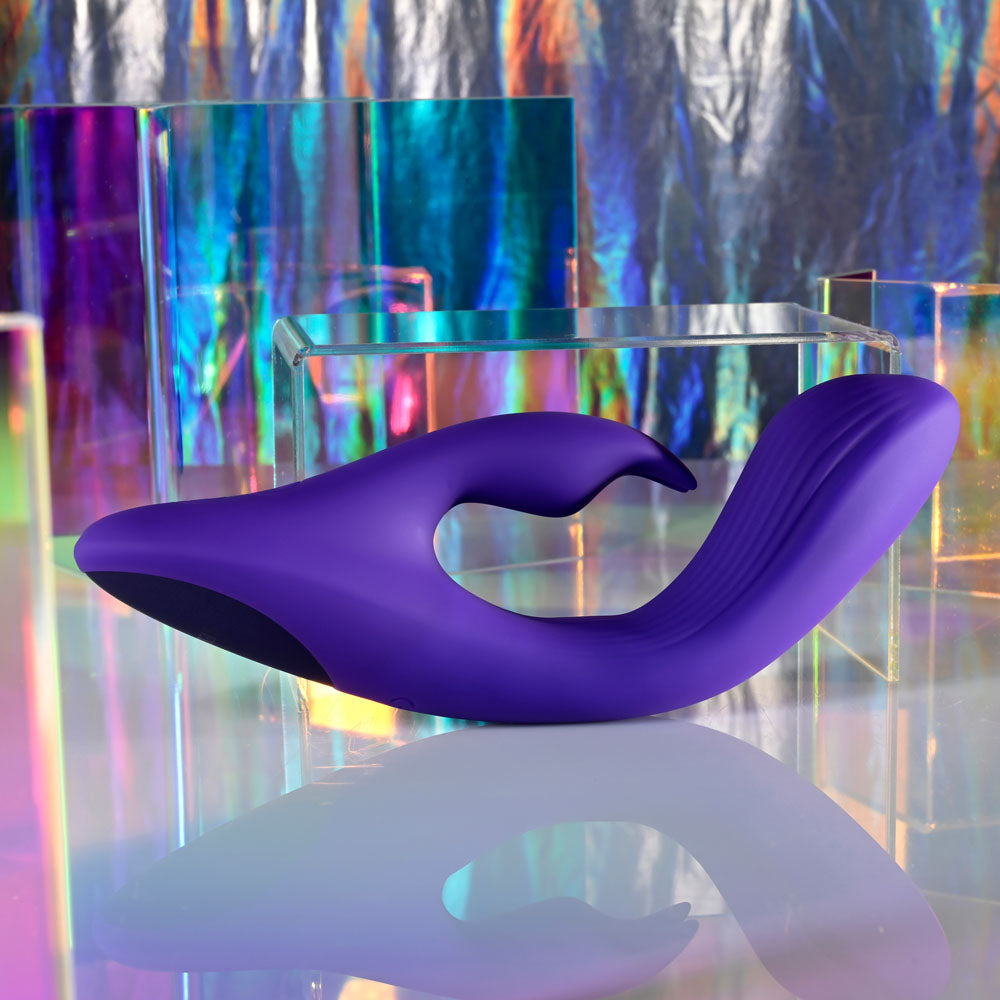 Selopa POSEABLE BUNNY - 21 cm USB Rechargeable Poseable Rabbit Vibrator on a colorful reflective surface.