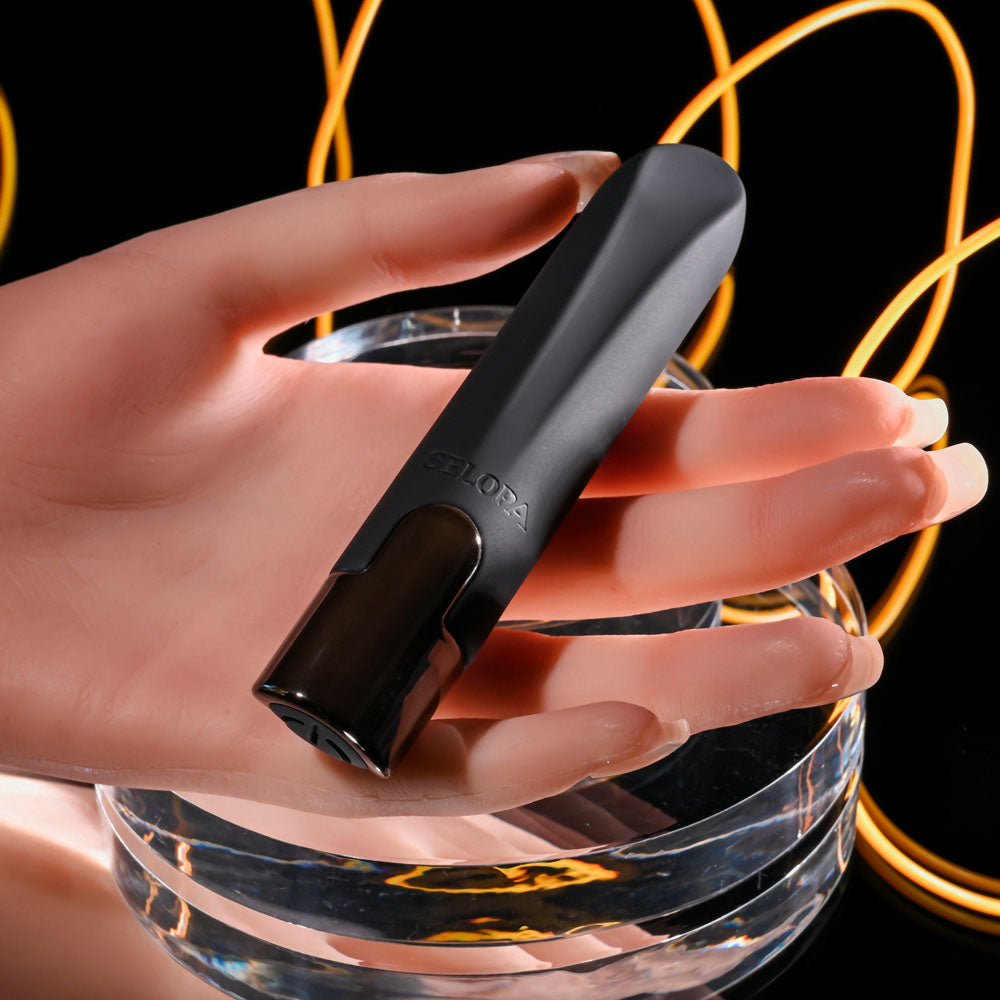 Selopa LITTLE BUDDY - 11.1 cm USB Rechargeable Vibrating Bullet in hand with stylish chrome base.
