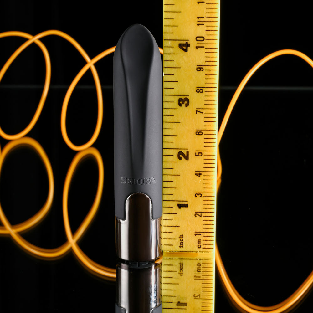 Selopa LITTLE BUDDY -  11.1 cm USB Rechargeable Vibrating Bullet next to a measuring tape for size reference.