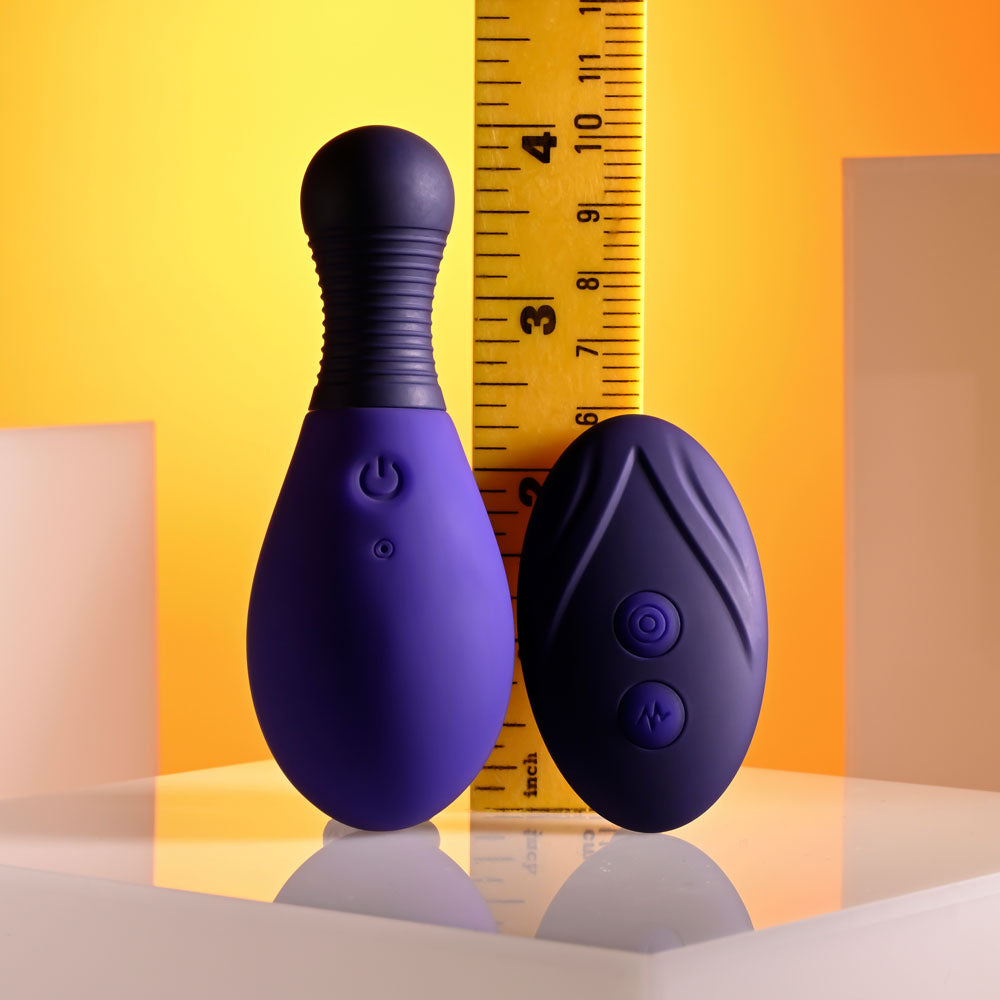 Selopa EGG ME ON - 10 cm USB Rechargeable Egg with Wireless Remote alongside a measuring ruler for size reference.