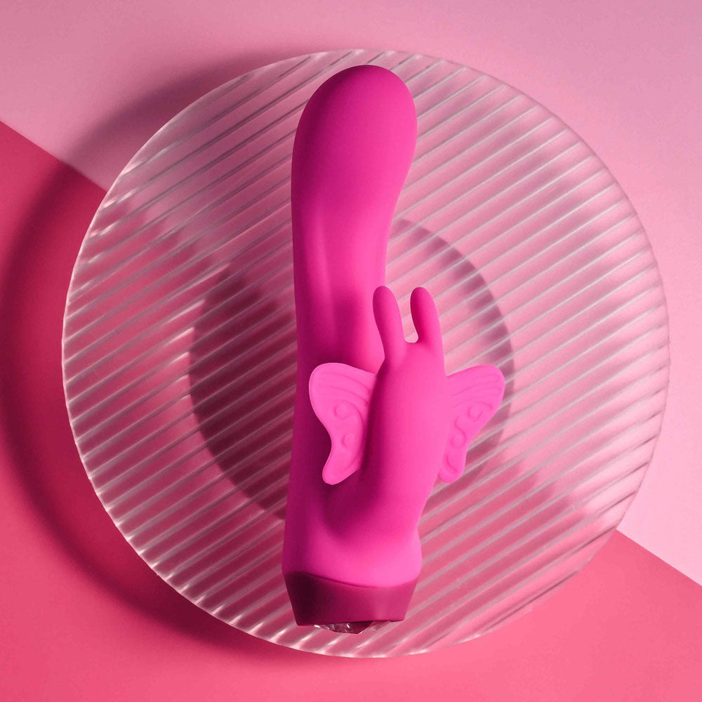 Selopa BUTTERFLY LOVE -  13.8 cm USB Rechargeable Butterfly Vibrator on a round plate.