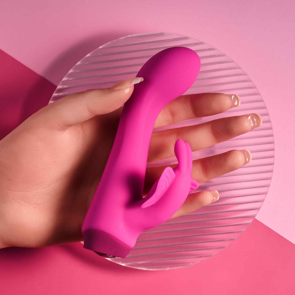 Selopa BUTTERFLY LOVE -  13.8 cm USB Rechargeable Butterfly Vibrator in a hand, showcasing its sleek design and vibrant color.