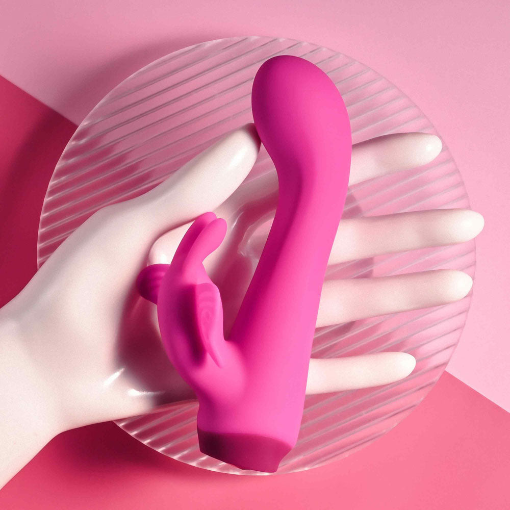 Selopa BUTTERFLY LOVE -  13.8 cm USB Rechargeable Butterfly Vibrator displayed in a hand on a pink background.