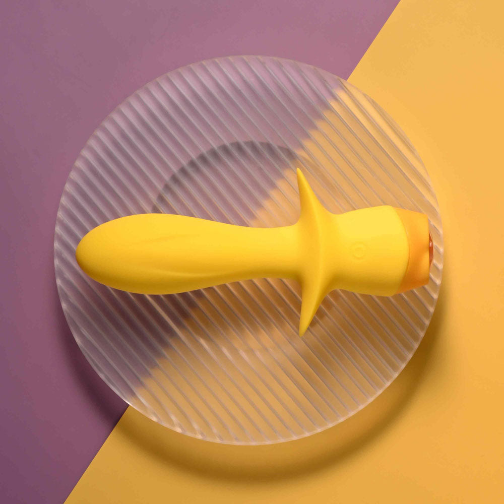Selopa MELLOW - 13.5 cm USB Rechargeable Vibrating Anal Plug on a textured plate, bright yellow design.