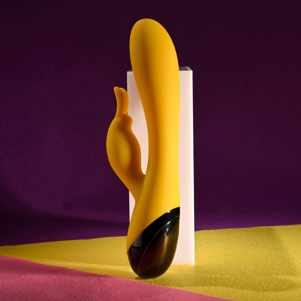 Selopa BUZZZ BUNNY -  19.7 cm USB Rechargeable Rabbit Vibrator on a vibrant background.