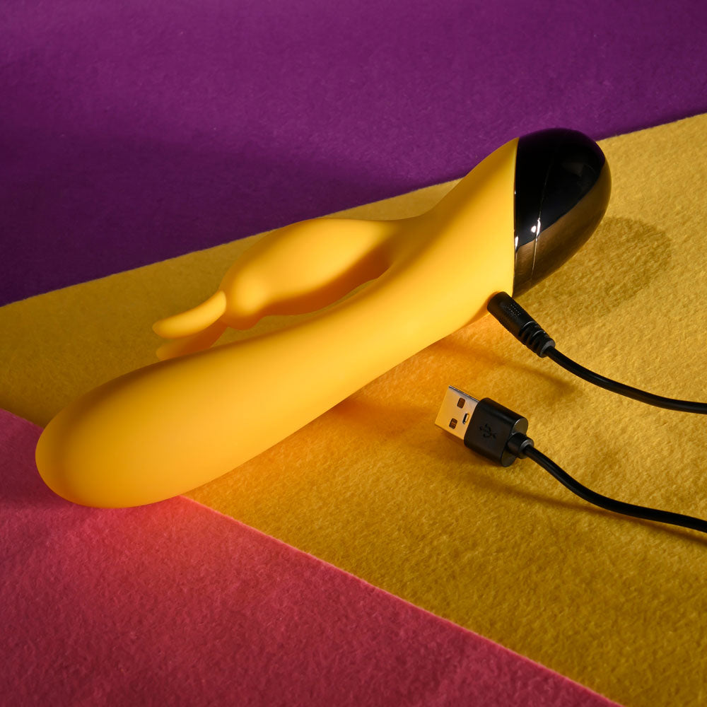 Selopa BUZZZ BUNNY - 19.7 cm USB Rechargeable Rabbit Vibrator on colorful background with charging cable