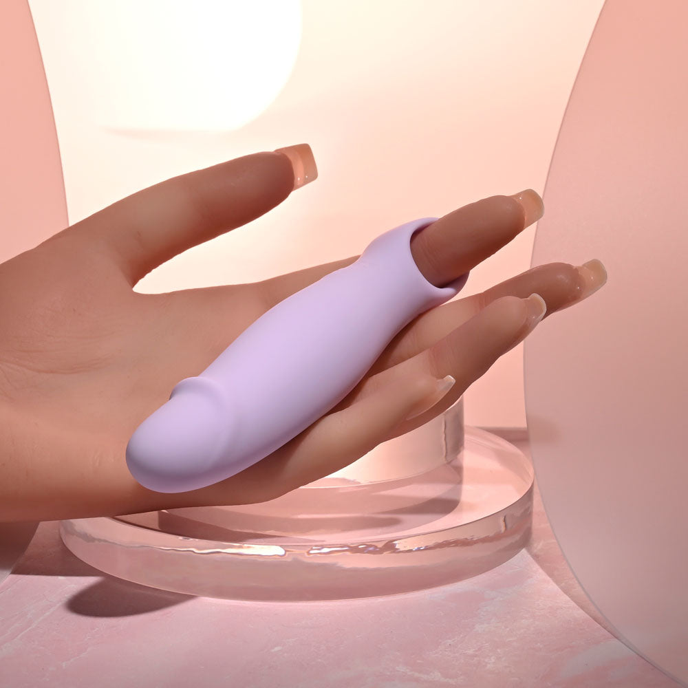 Selopa PETITE PECKER -  11.7 cm USB Rechargeable Mini Vibrator in hand, showcasing its compact design for targeted pleasure.