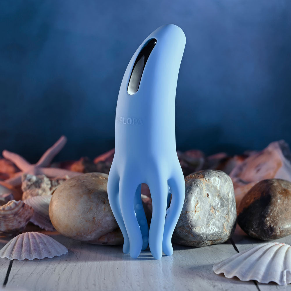 Selopa TENTACLE TICKLER - USB Rechargeable Vibrating Stimulator with a unique design on a shell-filled background.
