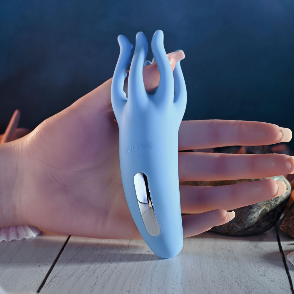 Selopa TENTACLE TICKLER - USB Rechargeable Vibrating Stimulator held in hand with textured tentacles.