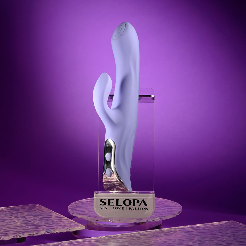 Evolved LAVENDER LOVE - 23.3 cm USB Rechargeable Rabbit Vibrator displayed against a purple background.