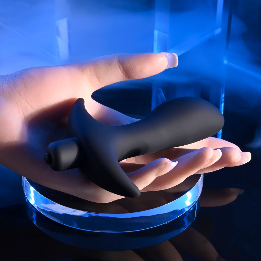 Selopa P-SPOT TRAINER - 12.7 cm Vibrating Prostate Massager held in hand, featuring thumb-shaped tip and flared safety base.