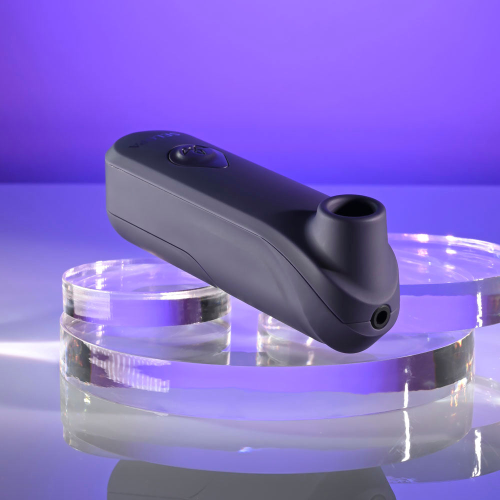 Selopa SURE THING -  Vibrating & Sucking Stimulator on clear glass with a purple background.