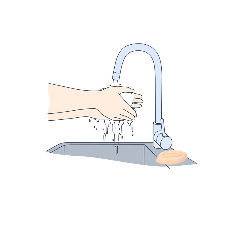 Washing hands with S-Line Pussy Soap -  Novelty Soap at a sink to create lather and cleanliness.
