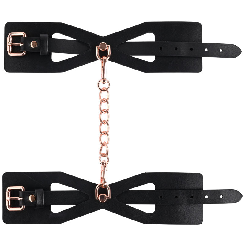 Sex & Mischief Brat Handcuffs - /Rose Gold Restraints showcasing black leather with rose gold chain accents.