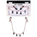 Sex & Mischief Brat Charmed Nipple Clamps -  Nipple Clamps with 45 cm Chain in stylish packaging.