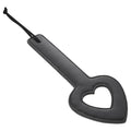 Sex & Mischief Shadow Heart Paddle - Paddle in sleek black leather design with heart cutout and sturdy handle.