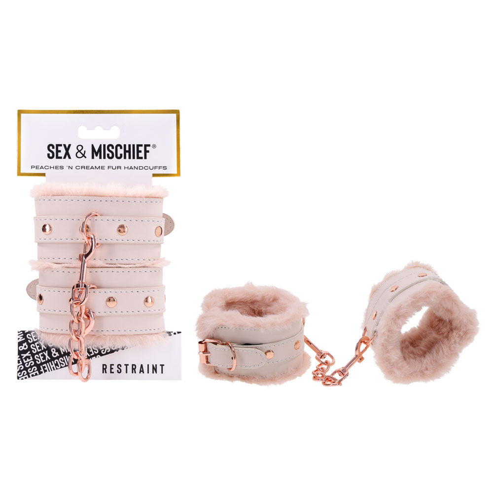 Sex & Mischief Peaches n CreaMe Fur Handcuffs - Peach Restraints on display, perfect for intimate essentials for her.