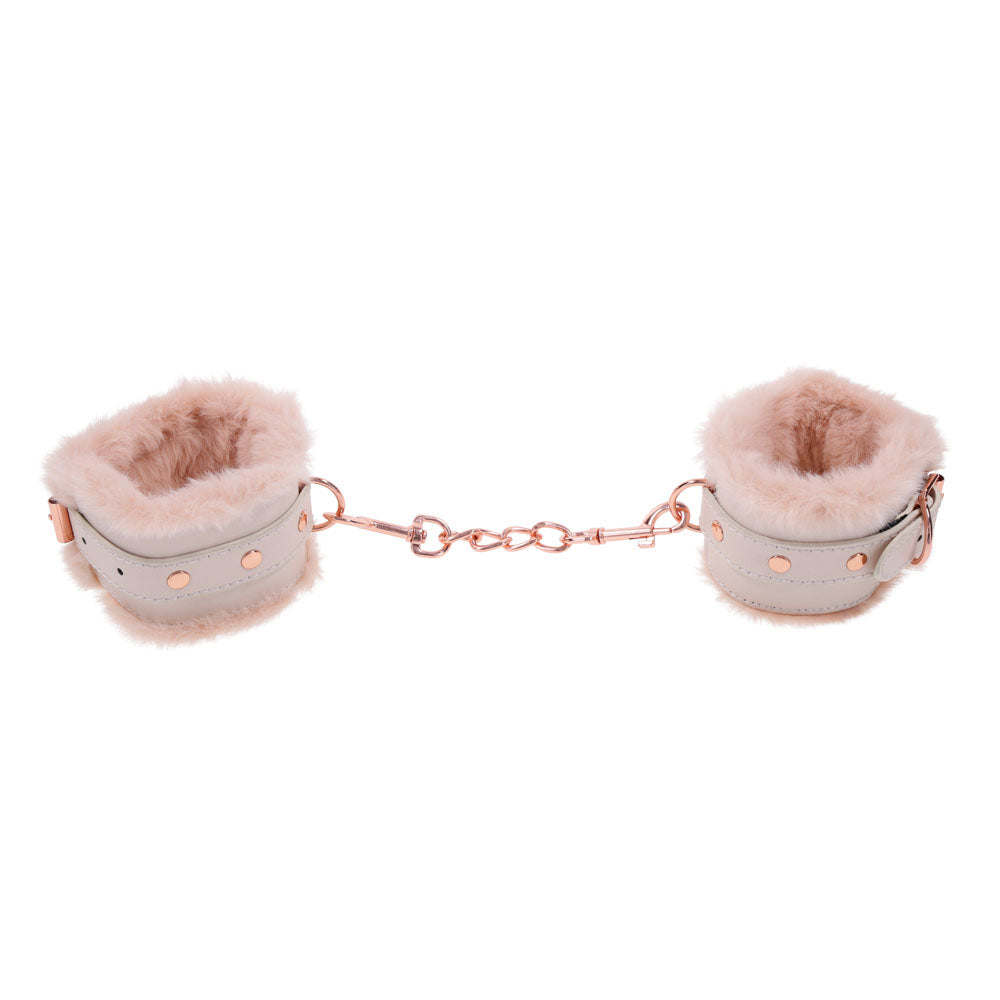 Sex & Mischief Peaches n CreaMe Fur Handcuffs - Peach Restraints with faux fur for intimate moments.