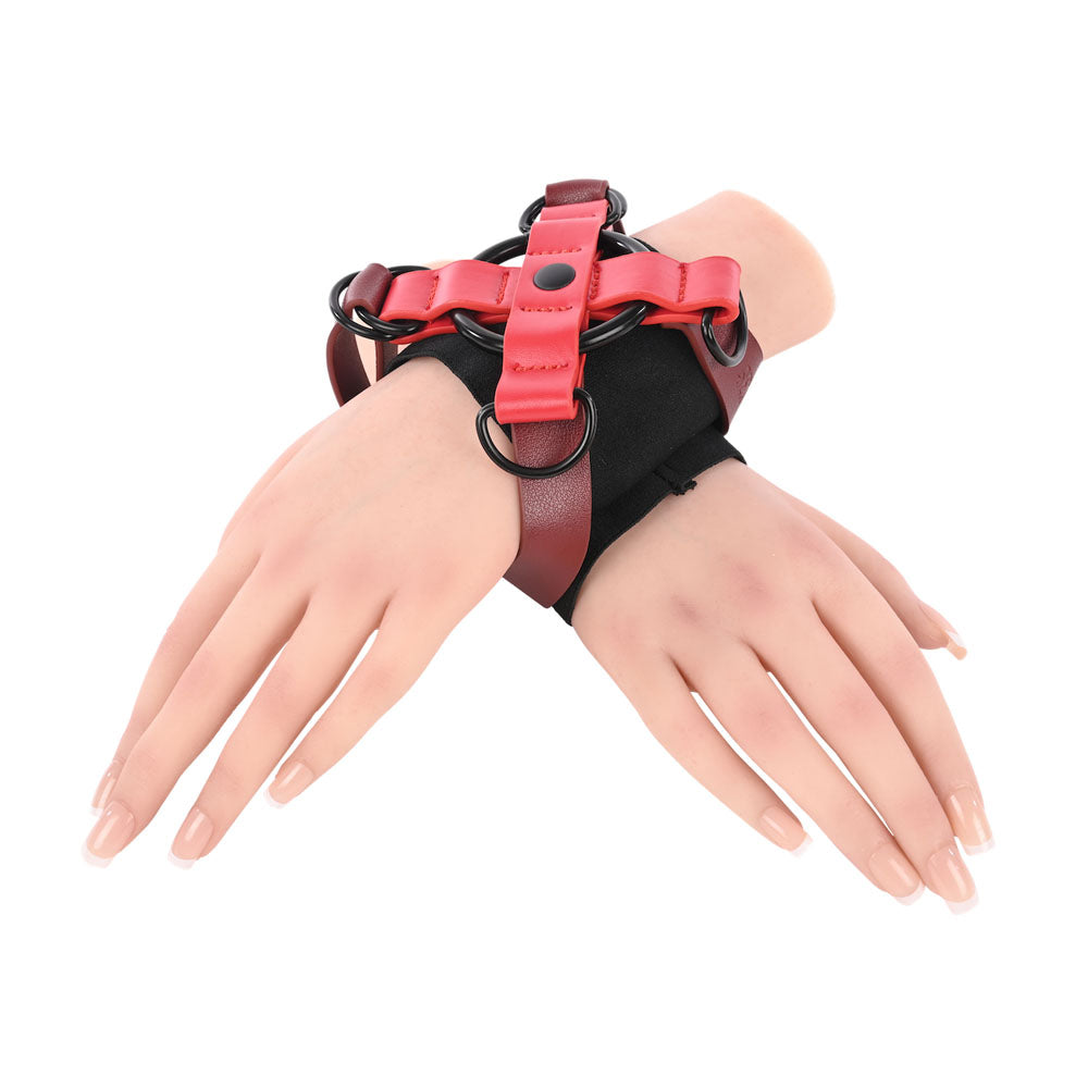 S&M Exs & Ohs Cross Cuffs - /Black Restraints featuring red and black design for thrilling restraint.