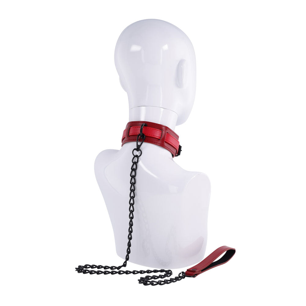 S&M Exs & Ohs Collar and Leash -  Neck Restraint displayed on a mannequin, showcasing a red faux leather collar with a black chain leash.
