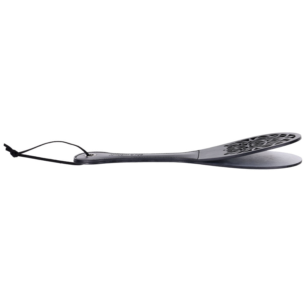Sex & Mischief Lace Spanker - Spanking Paddle side view showcasing intricate lace design and faux leather finish.