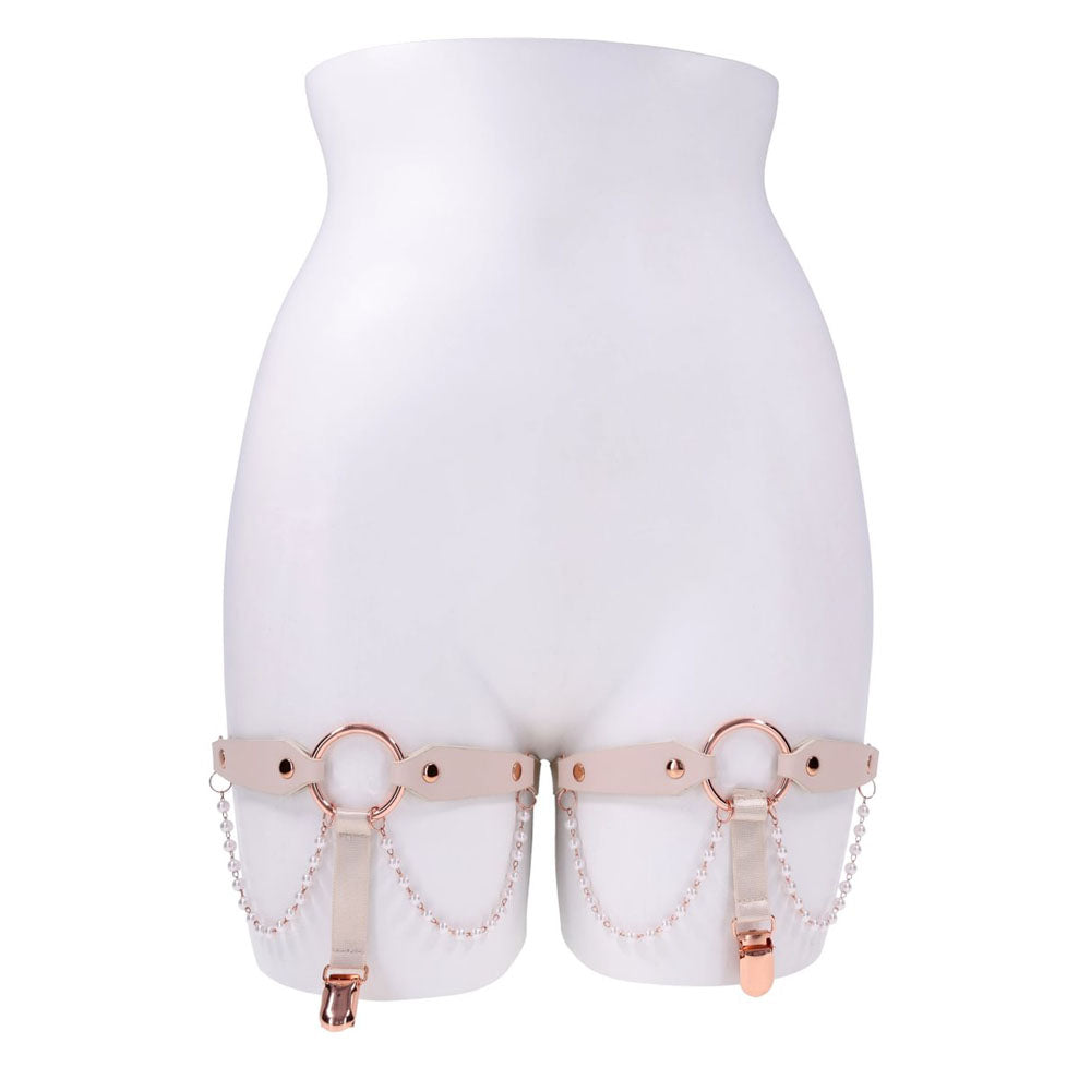 Sex & Mischief Peaches n CreaMe Pearl Garters - Peach / Rose Gold Garters with Pearls - Set of 2 on display.