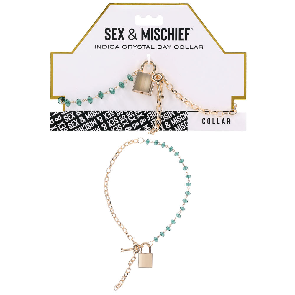 Sex & Mischief Indica Crystal Day Collar - Gold/Emerald Lockable Collar showcasing green gems and a gold chain.