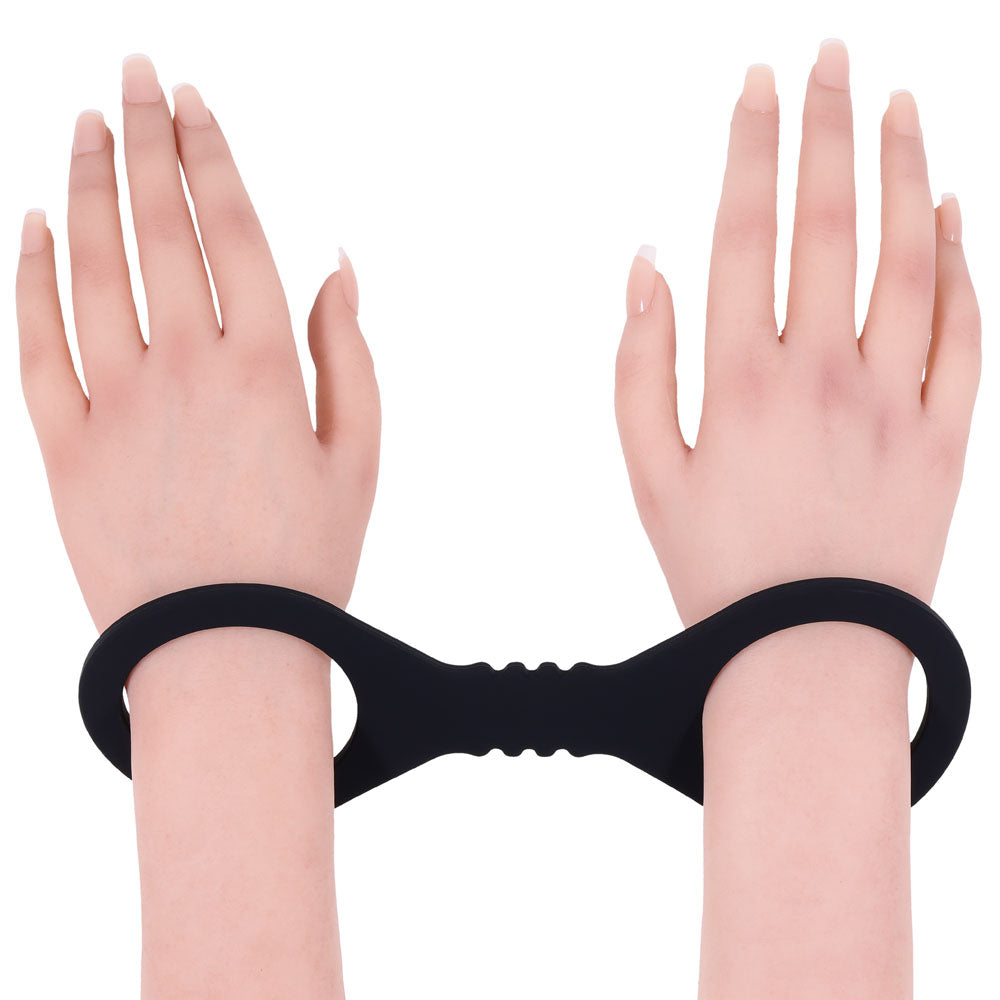 Sex & Mischief Shadow Small Silicone Cuffs -  Small Restraints on wrists, featuring smooth and stretchy black silicone.