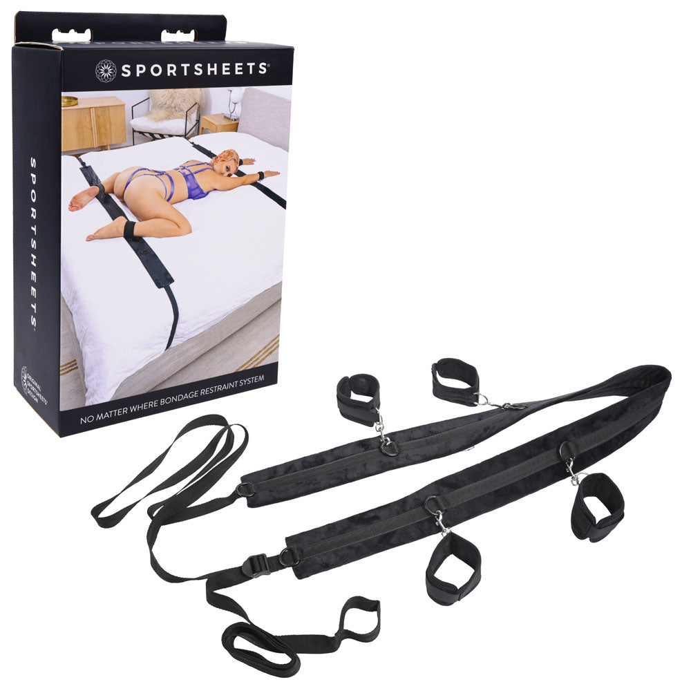 SPORTSHEETS No Matter Where Bondage Restraint System - Bed Restraints displayed on a bed with a model demonstrating use.