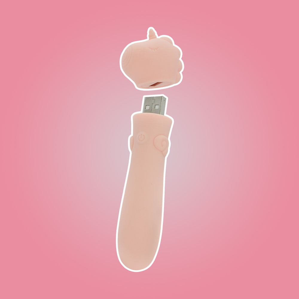 Unihorn - USB Bullet - Heart Throb - Coral USB Rechargeable Vibrating Bullet on a pink background.
