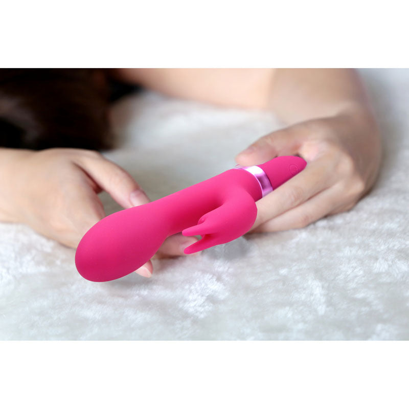 Vive Zosia - 21.3 cm USB Rechargeable Rabbit Vibrator held on soft surface, showcasing its silicone design.