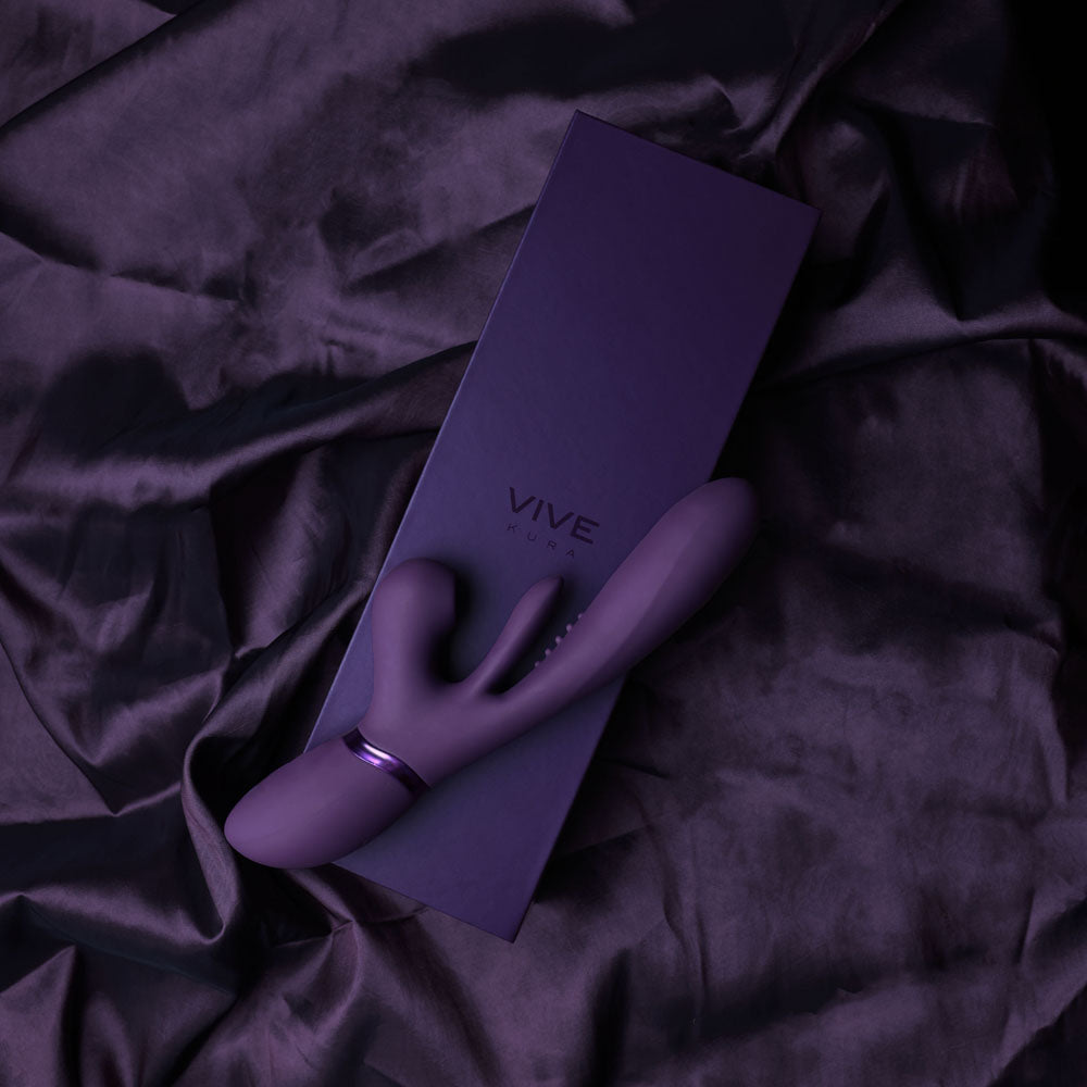 VIVE Ena -  -  25 cm USB Rechargeable Thrusting Vibrator with Air Wave Stimulator on a purple satin background.